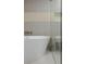 Close up of bathroom with soaking tub and glass enclosed shower at 9101 Alta Dr # 207, Las Vegas, NV 89145