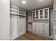 Large walk-in closet with custom shelving, drawers, and hanging rods at 9101 Alta Dr # 207, Las Vegas, NV 89145