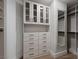 Custom designed closet features built-in cabinets, drawers, shelves, and ample storage space at 9101 Alta Dr # 207, Las Vegas, NV 89145