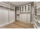 Spacious closet with custom built-in shelving, drawers, and cabinets provides ample storage at 9101 Alta Dr # 207, Las Vegas, NV 89145