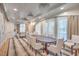 Elegant dining room with ample seating, chandelier lighting, and bright windows at 9101 Alta Dr # 207, Las Vegas, NV 89145