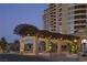 Elegant entrance with covered porte cochere, manicured landscaping, and beautiful stonework at 9101 Alta Dr # 207, Las Vegas, NV 89145