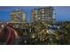 Exterior view of luxury high-rise towers with palm trees and manicured landscaping at 9101 Alta Dr # 207, Las Vegas, NV 89145