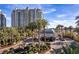 Exterior view of a luxury high-rise building with gate and lush landscaping at 9101 Alta Dr # 207, Las Vegas, NV 89145