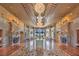 Grand foyer featuring marble floors, intricate ceiling details, and elegant chandeliers at 9101 Alta Dr # 207, Las Vegas, NV 89145
