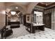 Grand hallway with marble accents, arched doorways, and custom cabinetry offers a glimpse of the home's lavish style at 9101 Alta Dr # 207, Las Vegas, NV 89145