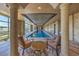 Luxurious indoor pool with marble accents, columns, and natural light at 9101 Alta Dr # 207, Las Vegas, NV 89145