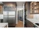 Modern kitchen featuring stainless steel appliances, including a wine refrigerator and pantry at 9101 Alta Dr # 207, Las Vegas, NV 89145