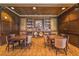 Elegant library with wood paneling, built-in bookshelves, two tables, and refined decor at 9101 Alta Dr # 207, Las Vegas, NV 89145