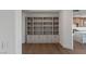 Living room featuring custom built-in shelves and cabinets, perfect for organization and display at 9101 Alta Dr # 207, Las Vegas, NV 89145
