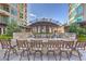 Upscale outdoor kitchen with built-in grill and bar seating for entertaining at 9101 Alta Dr # 207, Las Vegas, NV 89145