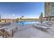 Inviting pool area with lounge chairs and umbrellas, perfect for relaxation at 9101 Alta Dr # 207, Las Vegas, NV 89145