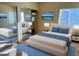 Stylized bedroom with a comfortable king-size bed, mirrored closet, and contemporary decor at 9470 Peace Way # 233, Las Vegas, NV 89147