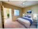 Comfortable bedroom featuring a ceiling fan, a window, and a well-made bed and nightstands at 9470 Peace Way # 233, Las Vegas, NV 89147