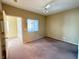 Spacious bedroom featuring neutral walls, a ceiling fan, a window, and carpeted floors at 9470 Peace Way # 233, Las Vegas, NV 89147