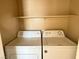 Convenient laundry featuring a stacked washer and dryer unit at 9470 Peace Way # 233, Las Vegas, NV 89147