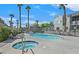 Community pools and palm trees create a vacation feel at 9470 Peace Way # 233, Las Vegas, NV 89147