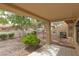 Covered patio view with mature landscaping, offering a tranquil outdoor space at 9533 Yucca Blossom Dr, Las Vegas, NV 89134