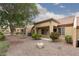 Charming backyard with rock landscaping, mature trees, and a well-maintained exterior at 9533 Yucca Blossom Dr, Las Vegas, NV 89134