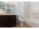 Bathroom featuring a single sink vanity, toilet, and shower-tub combination at 9533 Yucca Blossom Dr, Las Vegas, NV 89134