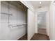 Walk-in closet with wire shelving, leading to an ensuite bathroom at 9533 Yucca Blossom Dr, Las Vegas, NV 89134