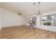 Airy living room with wood floors, recessed lighting, and access to the backyard through sliding doors at 9533 Yucca Blossom Dr, Las Vegas, NV 89134