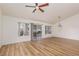 Bright living room with wood-look flooring, and large windows offering outdoor views at 9533 Yucca Blossom Dr, Las Vegas, NV 89134