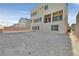 View of a large, flat backyard ready for personalization with a block wall for privacy at 9830 Wild Coyote Ct, Las Vegas, NV 89141