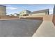 View of a flat, empty backyard surrounded by block wall fencing, perfect for customization at 9830 Wild Coyote Ct, Las Vegas, NV 89141