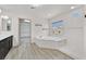 Bright bathroom featuring a soaking tub, walk-in closet, and neutral color palette at 9830 Wild Coyote Ct, Las Vegas, NV 89141