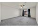 Open bedroom with ample carpet, fan, and a large window at 9830 Wild Coyote Ct, Las Vegas, NV 89141