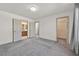 Bedroom with neutral carpet, ensuite access, and walk-in closet access for optimal convenience at 9830 Wild Coyote Ct, Las Vegas, NV 89141
