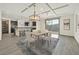 Open dining and kitchen area featuring an island with barstool seating at 9830 Wild Coyote Ct, Las Vegas, NV 89141