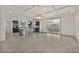 Open-concept kitchen and dining area with dark cabinets, stainless steel appliances, and a breakfast bar, ideal for modern living at 9830 Wild Coyote Ct, Las Vegas, NV 89141