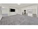 Open concept living area with gray carpet, modern design, and recessed lighting at 9830 Wild Coyote Ct, Las Vegas, NV 89141