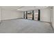 Spacious carpeted living area with many windows providing ample natural light at 9830 Wild Coyote Ct, Las Vegas, NV 89141