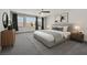 Spacious bedroom with large windows, stylish furnishings, and ample natural light at 9830 Wild Coyote Ct, Las Vegas, NV 89141