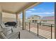 Covered patio with outdoor seating overlooking the neighborhood at 9830 Wild Coyote Ct, Las Vegas, NV 89141