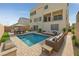 Inviting backyard with a private pool, outdoor seating, and a built-in grill at 9830 Wild Coyote Ct, Las Vegas, NV 89141
