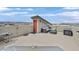 Rooftop patio featuring lounge furniture and a grill area, perfect for outdoor entertaining with views of the neighborhood at 9830 Wild Coyote Ct, Las Vegas, NV 89141