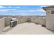 This rooftop patio includes a built-in BBQ and overlooks the surrounding community at 9830 Wild Coyote Ct, Las Vegas, NV 89141