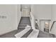 Carpeted staircase with modern railings leads to the upper level at 9830 Wild Coyote Ct, Las Vegas, NV 89141