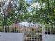 The front of the house, number 1812, featuring manicured landscaping, a white fence, and a welcoming entrance at 1812 Ivanhoe Way, Las Vegas, NV 89102