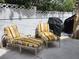 Comfortable outdoor seating area with striped cushions, perfect for relaxing and enjoying the outdoors at 1812 Ivanhoe Way, Las Vegas, NV 89102