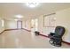 Finished basement with light-colored walls, recessed lights, and sliding glass door access to outdoors at 9614 Orchard Oasis Ct, Las Vegas, NV 89147