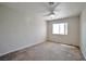 Bright bedroom featuring a ceiling fan and natural light streaming through the window at 9614 Orchard Oasis Ct, Las Vegas, NV 89147