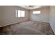 Spacious bedroom featuring multiple windows for natural light and a ceiling fan at 9614 Orchard Oasis Ct, Las Vegas, NV 89147