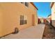 Exterior view with concrete walkway surrounded by well-maintained landscaping and fencing at 9614 Orchard Oasis Ct, Las Vegas, NV 89147