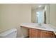 Powder room with vanity and a view to the entryway at 9614 Orchard Oasis Ct, Las Vegas, NV 89147