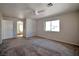 Large living room with ceiling fan and neutral walls perfect for entertaining and relaxation at 9614 Orchard Oasis Ct, Las Vegas, NV 89147